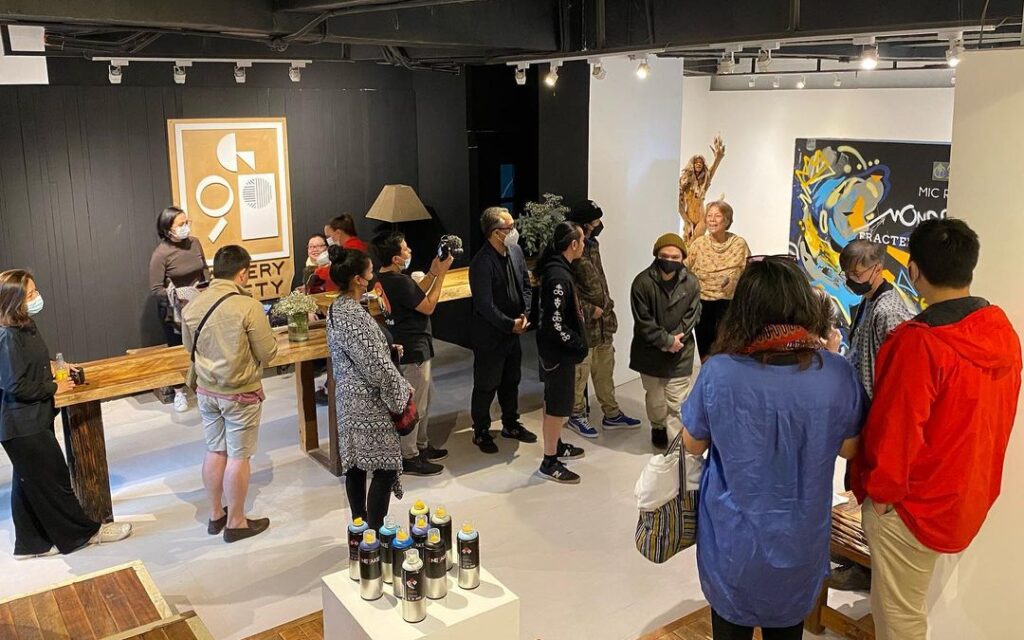 Audience listening to an artist talk at Gallery Ninety Baguio