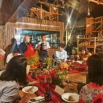 People listening to a dinner presentation