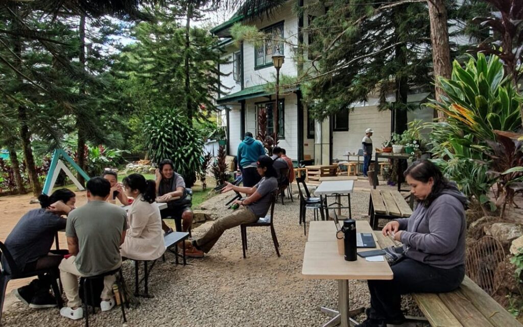 People having coffee outdoors at Hot Cat Specialty Coffee Baguio