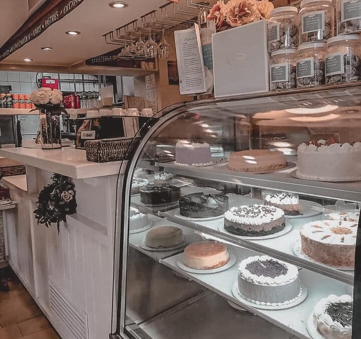 cakes and pastries displayed on glass case